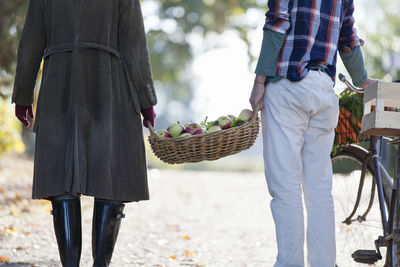 Couple with basket full of apples, stockholm, sweden
