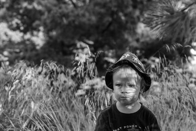 Portrait of a boy standing on field