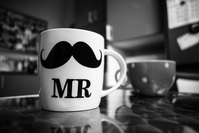 Close-up of coffee cup on table