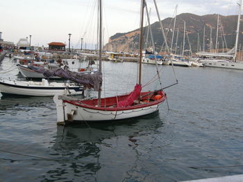 Boats moored at harbor