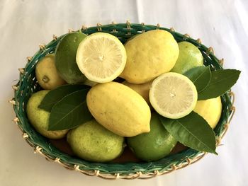 High angle view of fruits in basket on table