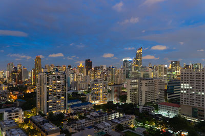 High angle view of modern buildings in city against sky