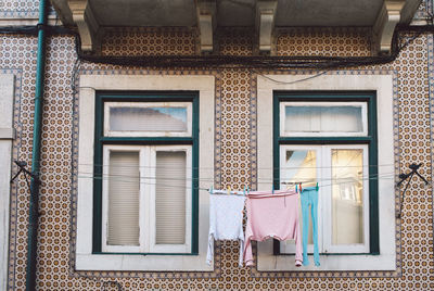 Low angle view of clothes drying outside building