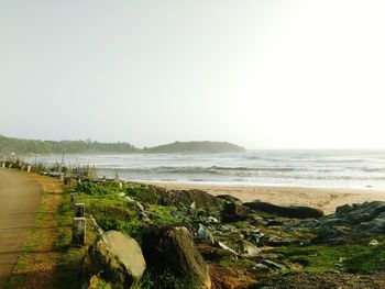 Scenic view of beach against clear sky