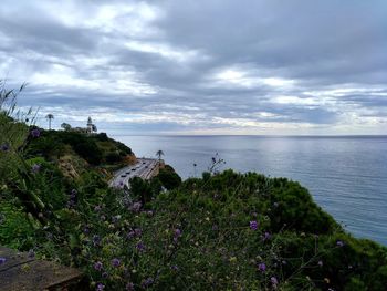 Scenic view of sea against cloudy sky