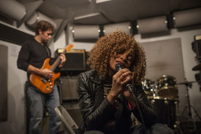 Musicians rehearsing in a recording studio