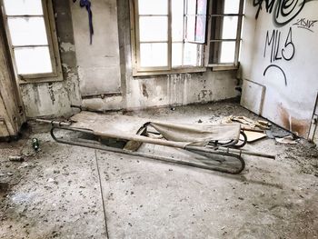 Damaged window in abandoned building