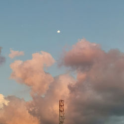 Low angle view of communications tower against sky