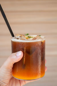 Close-up of hand holding drink