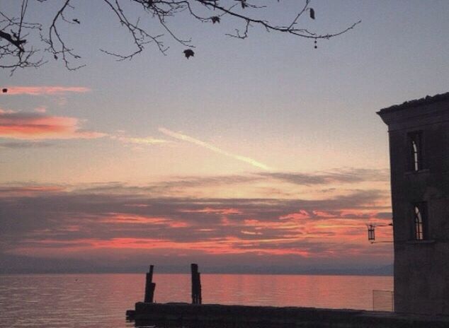 SCENIC VIEW OF SUNSET OVER SEA