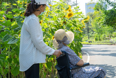 Caregiver help and care asian senior  woman patient sitting and happy 