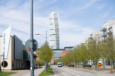 City street and buildings against sky