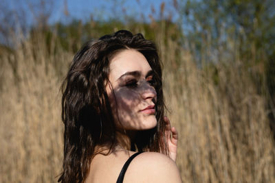 Portrait of beautiful young woman outdoors