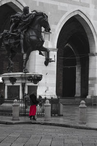 Woman standing against wall