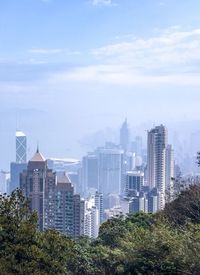 Buildings in city against sky
