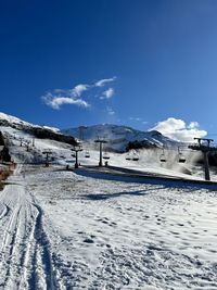 Scenic view of snow covered mountain against sky