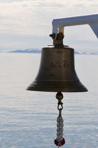 Ship's bell set against an arctic backdrop