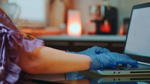 Midsection of woman working on table