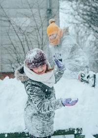 Girl playing in snow