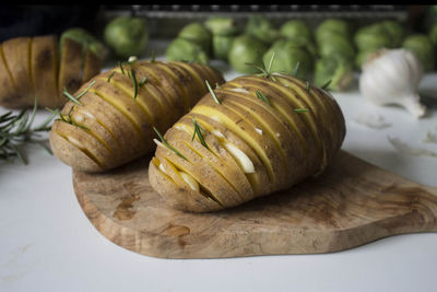 Close-up of potatoes on cutting board in kitchen