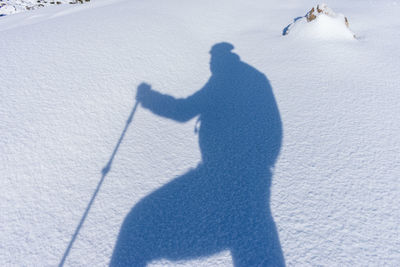 A mountaineer woman walking in snowy mountain
