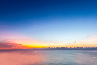 Scenic view of sea against romantic sky at sunset