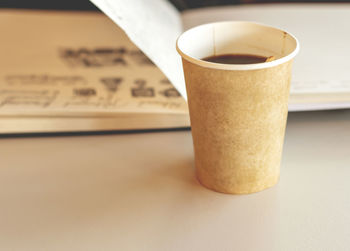 Close-up of coffee cup on table