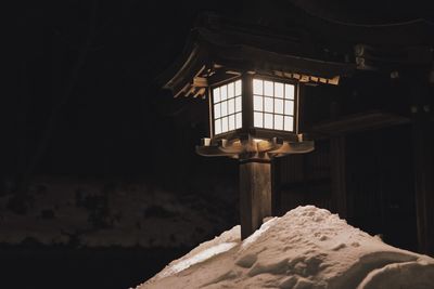 Low angle view of illuminated lantern at night