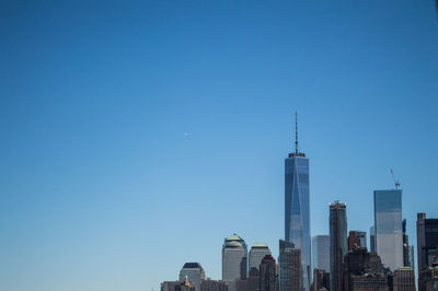 View of skyscrapers against blue sky