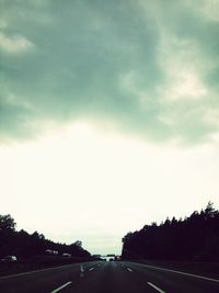 View of road against cloudy sky