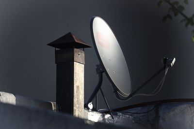 Low angle view of electric lamp on wall