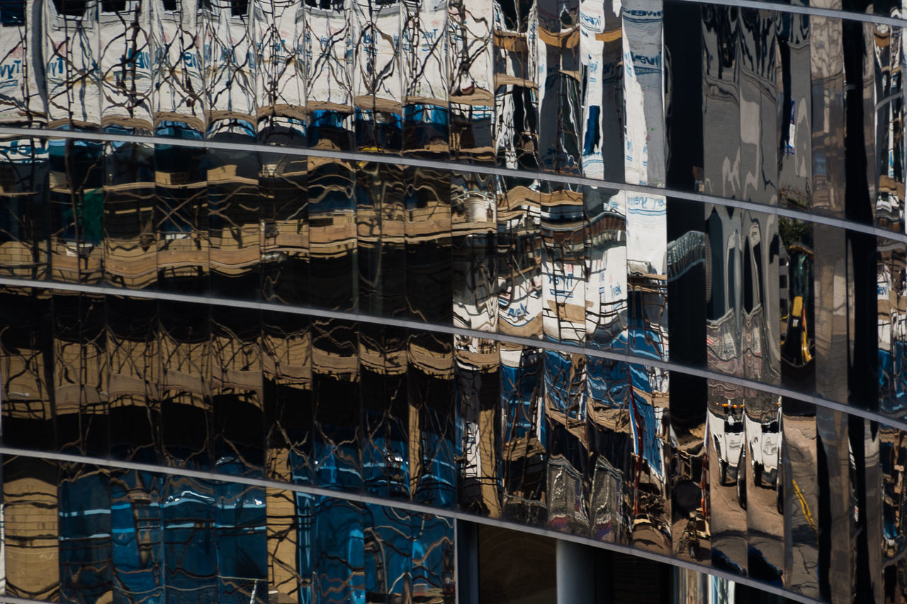 REFLECTION OF BUILDING IN GLASS