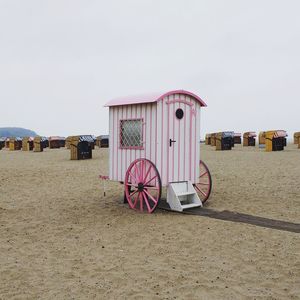 Lifeguard hut on beach against clear sky