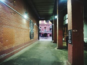 Empty corridor along buildings