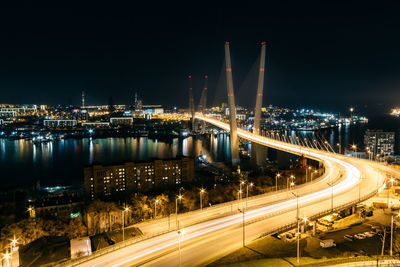 Illuminated light trails on road at night