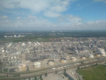 High angle view of buildings in city against sky