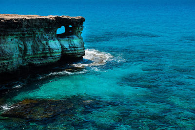 Scenic view of sea against blue sky