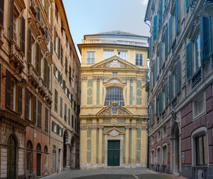 Street amidst buildings against sky