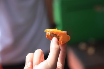 Close-up of hand holding food