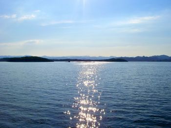 Scenic view of sea against blue sky