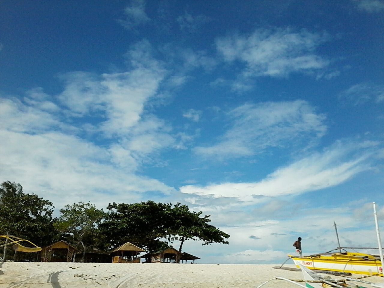 sky, cloud - sky, tree, cloud, blue, beach, nature, palm tree, cloudy, transportation, day, tranquility, sand, outdoors, beauty in nature, tranquil scene, sunlight, sea, low angle view, scenics