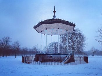 Built structure on snow covered field against sky at hyde park