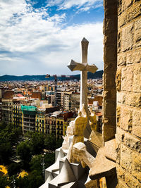 Buildings in city against sky