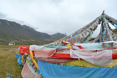 Clothes drying on clothesline against sky