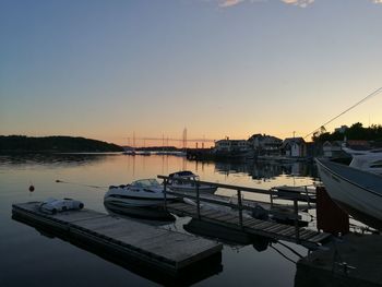 Boats moored at harbor