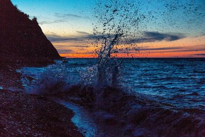 Full frame shot of wet window during sunset