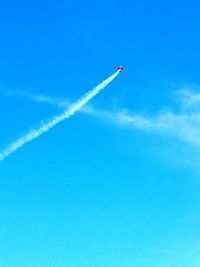 Low angle view of airplane flying in sky