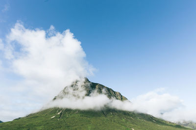 Low angle view of majestic mountain against sky