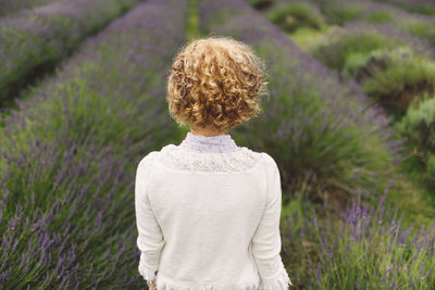 Rear view of woman against a lavender field