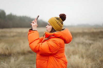 Young woman using smart phone outdoor